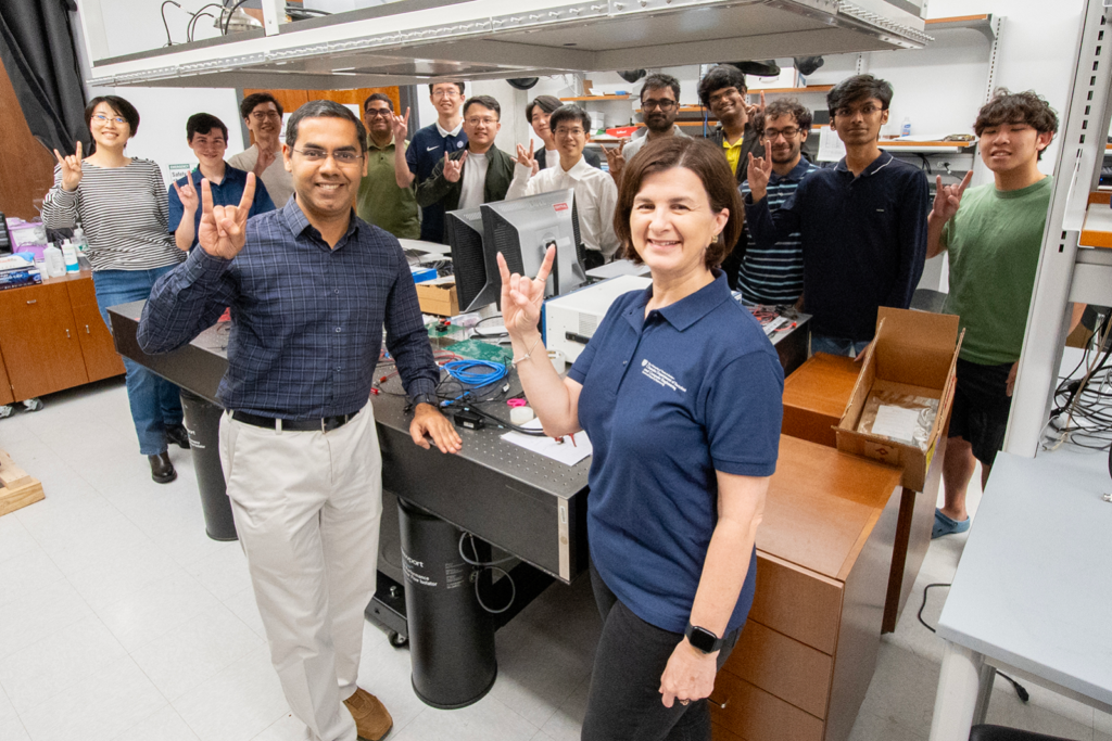Prof. Jaydeep Kulkarni, center left, and department chair Diana Marculescu, center right, along with the first cohort of students from the ASIC Design course.