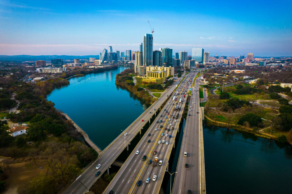 Austin, Texas aerial drone views above Coloradp River and Interstate 35